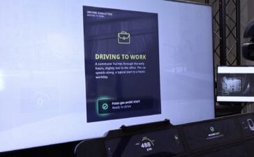 A driving simulator screen depicting the 