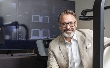 Smart Eye CEO Martin Krantz in a vehicle buck demoing the company's Automotive Interior Sensing software